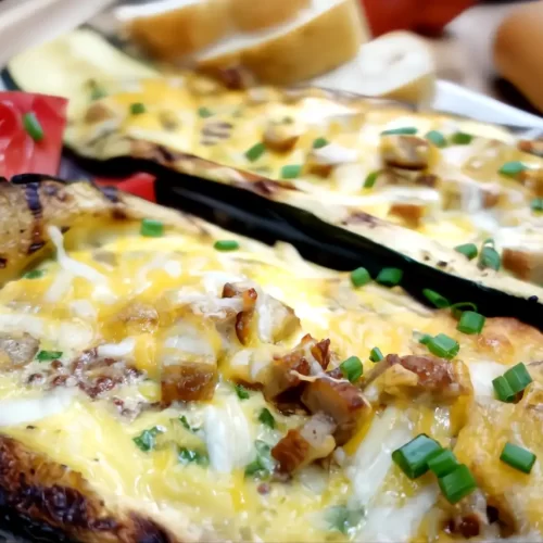 Grilled-breakfast-stuffed-zucchini-boats-filled-with-sausage-eggs-and-melted-cheddar-cheese