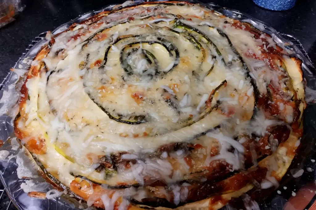Thin-zucchini-ribbons-baked-with-Parmesan-and-herbs-in-an-easy-crustless-zucchini-pie.