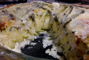 Thin-zucchini-ribbons-baked-with-Parmesan-and-herbs-in-an-easy-crustless-zucchini-pie-slice-removed