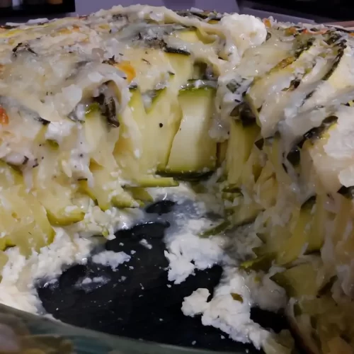 Thin-zucchini-ribbons-baked-with-Parmesan-and-herbs-in-an-easy-crustless-zucchini-pie-slice-removed