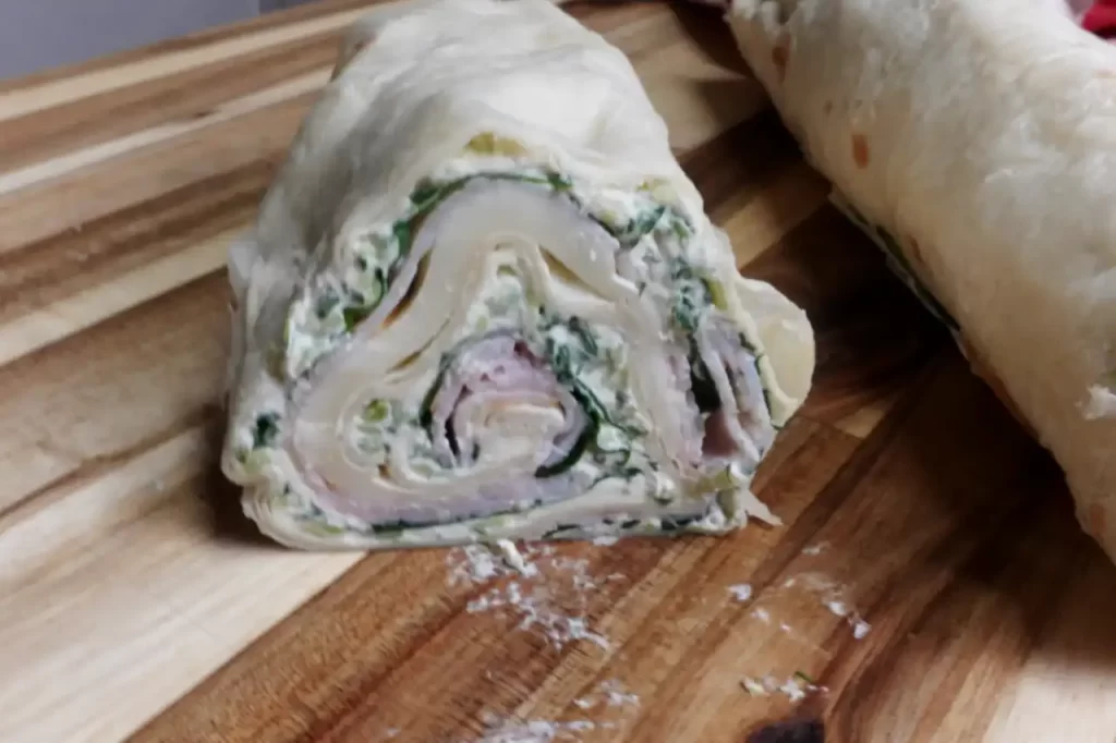 close-up-of-uncut-roll-of-turkey-cucumber-dill-pinwheels