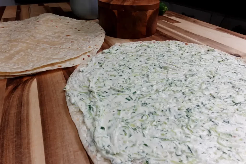 cucumber-spread-on-tortilla-for-turkey-cucumber-dill-pinwheels