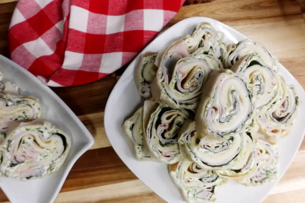 turkey-cucumber-pinwheels-top-view-on-white-plate.