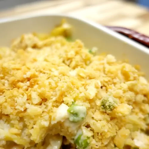 close up finished tuna noodle casserole in white baking dish