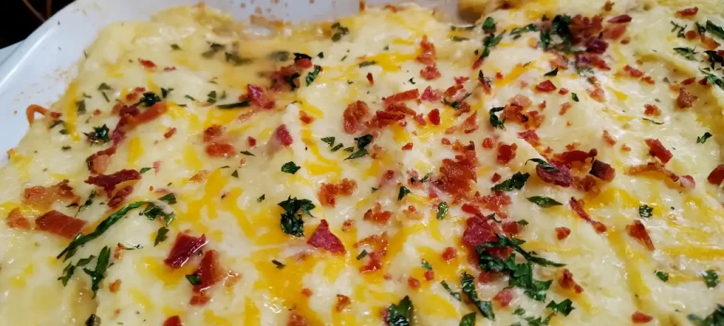 close-up-Loaded-meatloaf-casserole-in-a-baking-dish-with-melted-cheddar-and-crumbled-bacon-on-top